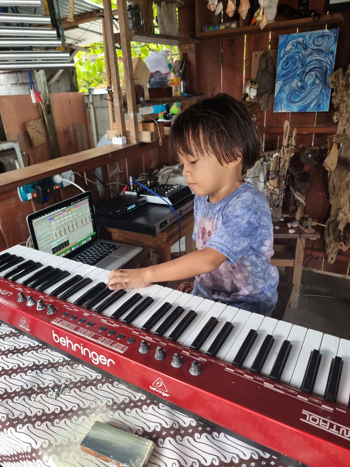 The next generation, working out a riff at home